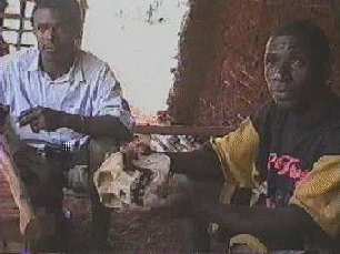 Joseph and friend with gorilla skull